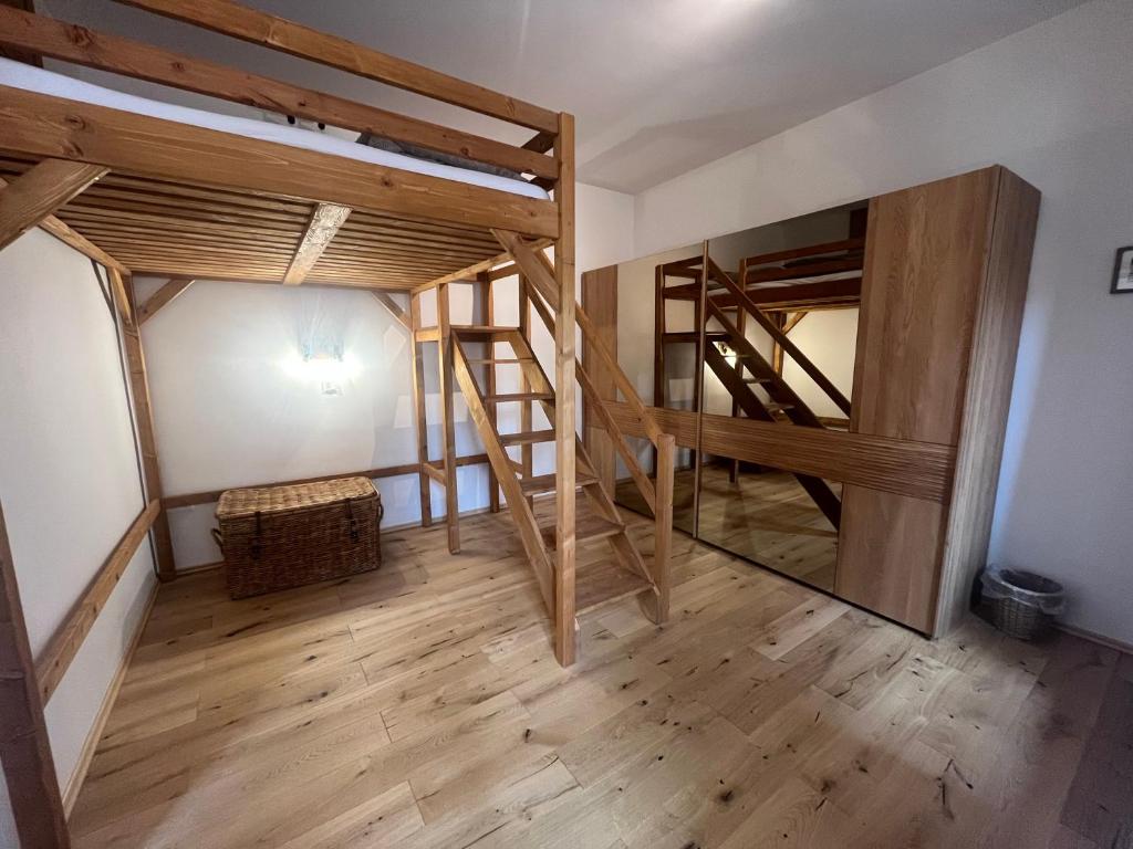 a room with two bunk beds and a mirror at Residence Spillenberg Apartment 1A in Levoča