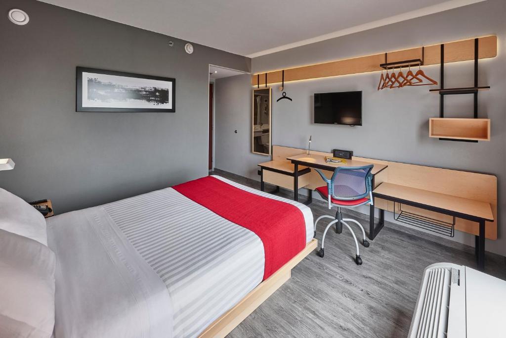 Postel nebo postele na pokoji v ubytování City Express by Marriott Irapuato