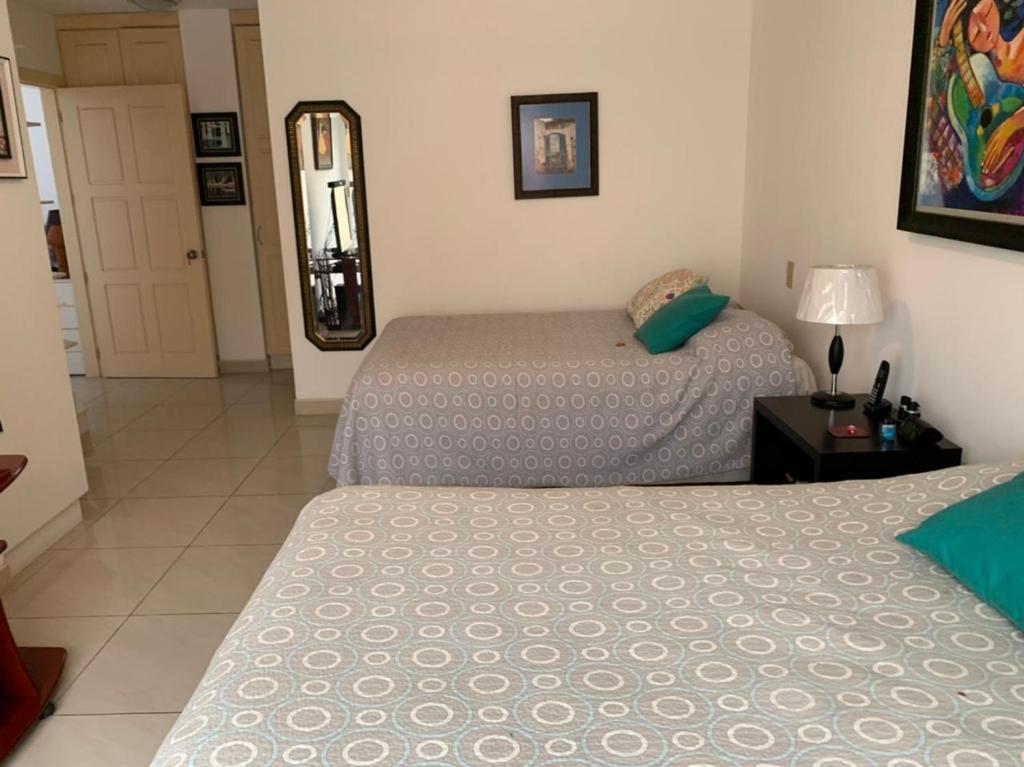 Кровать или кровати в номере Campus Residencias