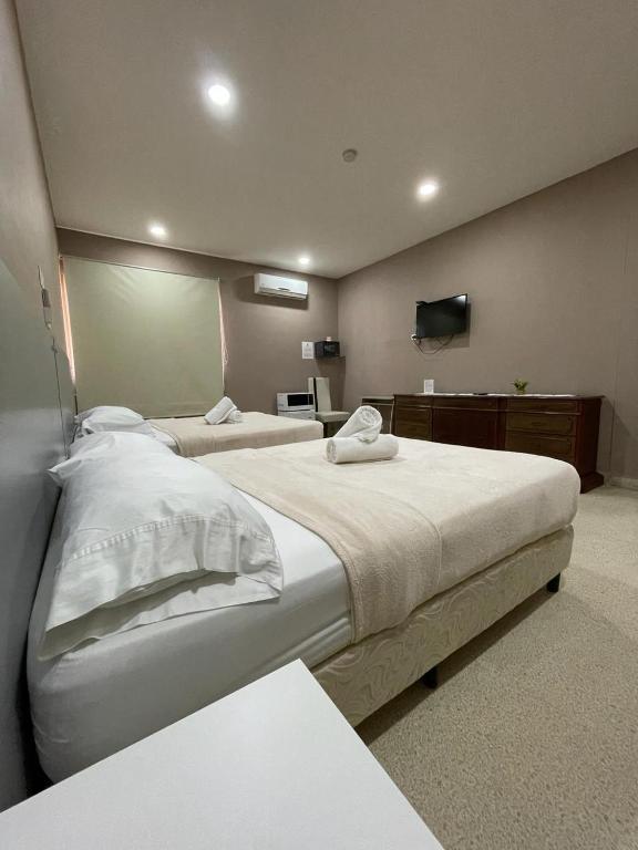 Voodi või voodid majutusasutuse Hostal EL Prado toas