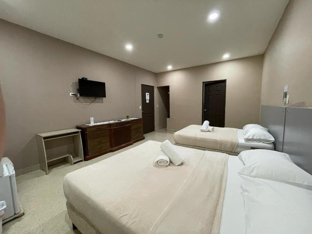 Voodi või voodid majutusasutuse Hostal EL Prado toas