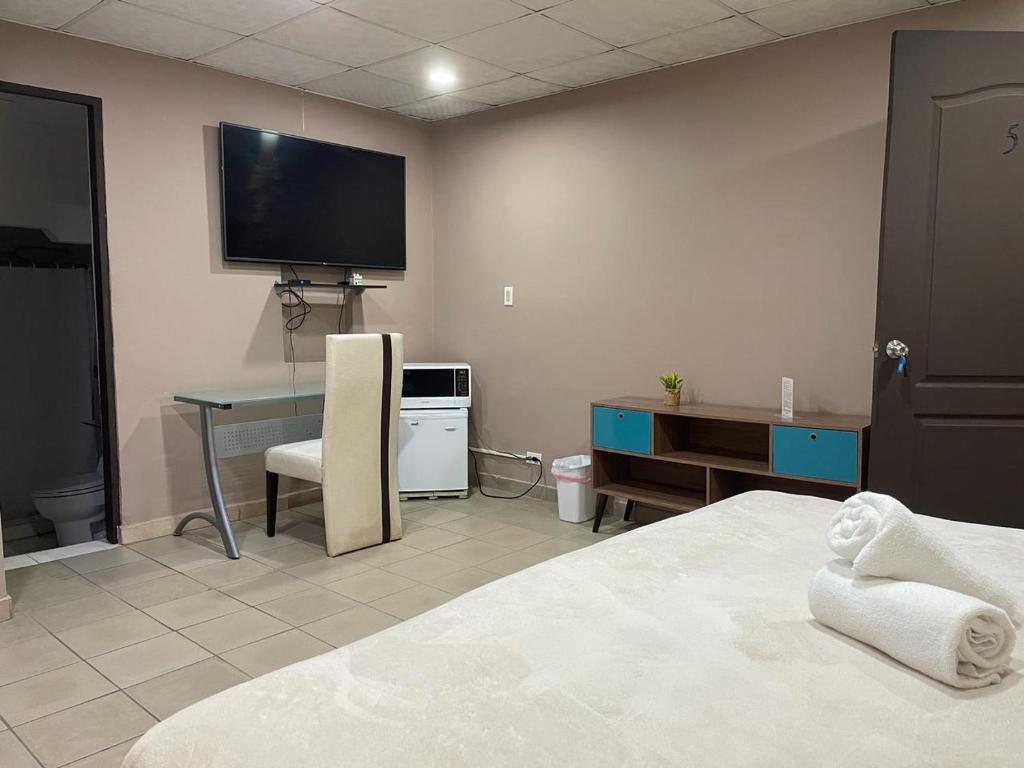 Voodi või voodid majutusasutuse Hostal EL Prado toas