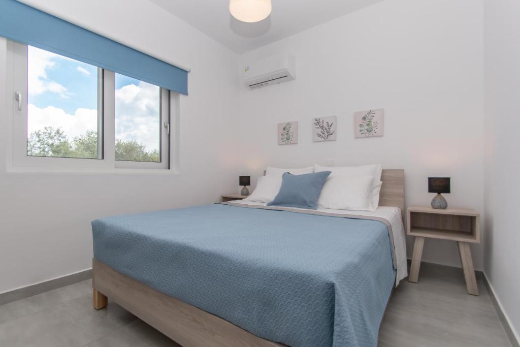 Postel nebo postele na pokoji v ubytování Villa Zoi