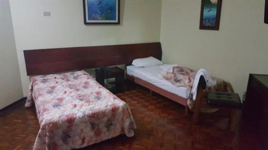 Posteľ alebo postele v izbe v ubytovaní El Hogar de Jhonny
