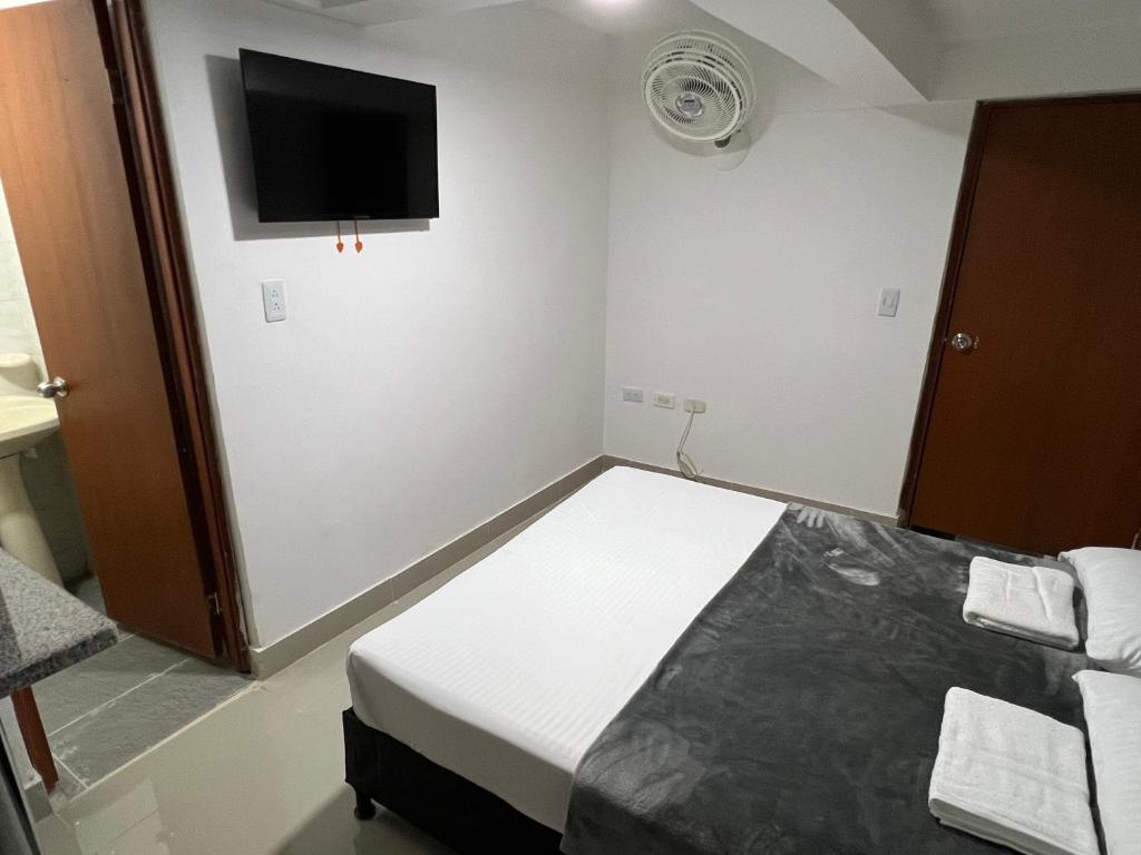 Postel nebo postele na pokoji v ubytování Hotel Coffee Real Pereira