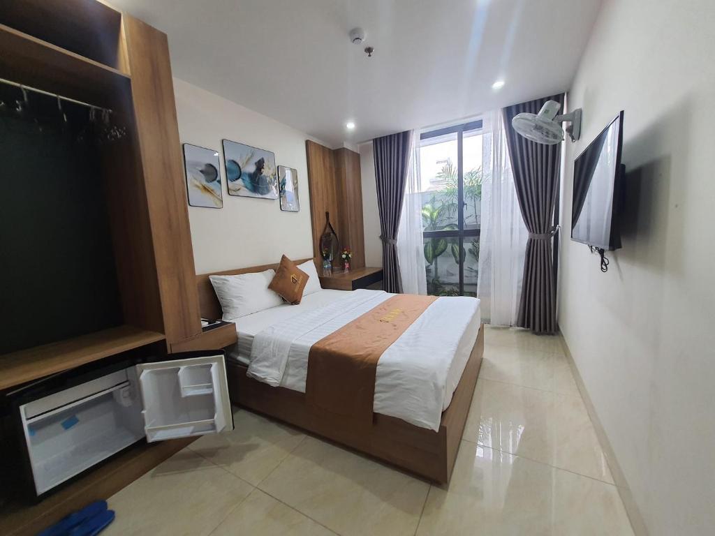 Μια τηλεόραση ή/και κέντρο ψυχαγωγίας στο Khách sạn HAWA HOTEL