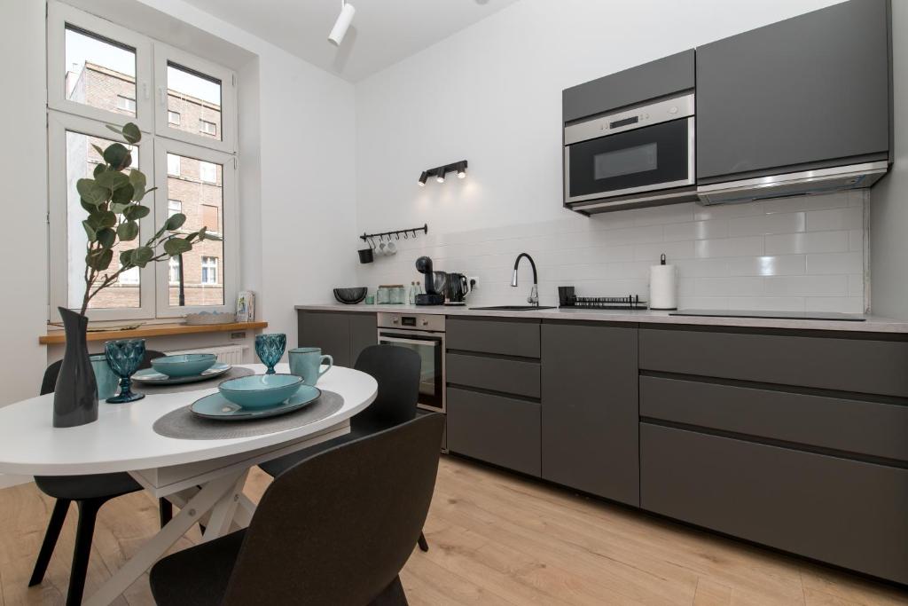 Η κουζίνα ή μικρή κουζίνα στο Apartament blisko Dworca