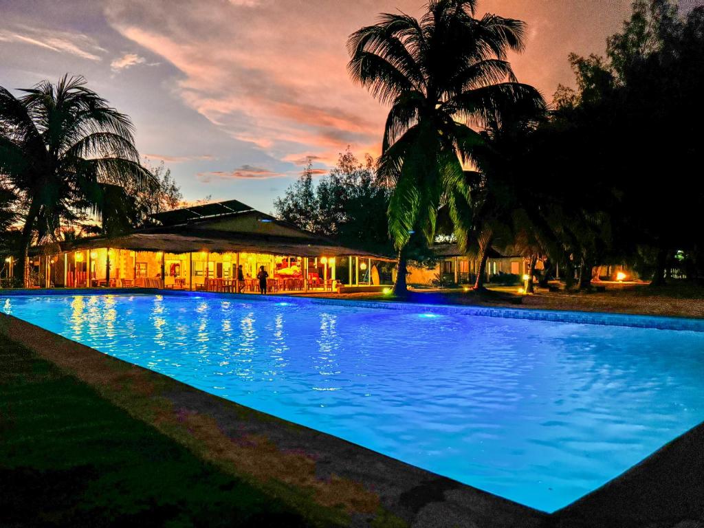 a large swimming pool in front of a building at Royal Sakalava in Diego Suarez