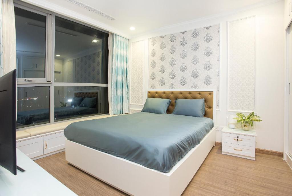 Postel nebo postele na pokoji v ubytování Saigon Downtown - Rivergate Residence