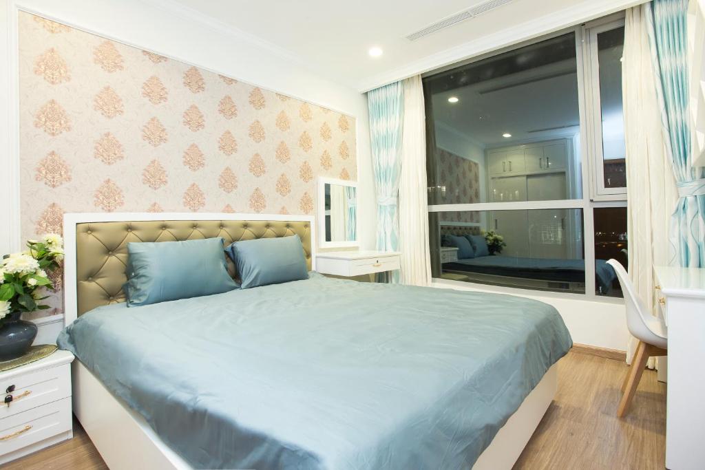 Postel nebo postele na pokoji v ubytování Saigon Downtown - Rivergate Residence