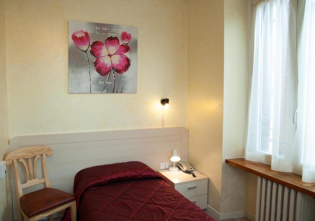 Postel nebo postele na pokoji v ubytování Antico Albergo