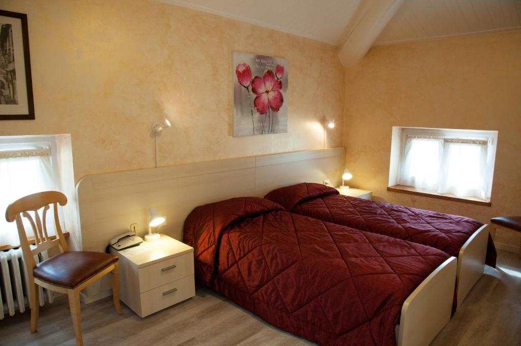 Postel nebo postele na pokoji v ubytování Antico Albergo