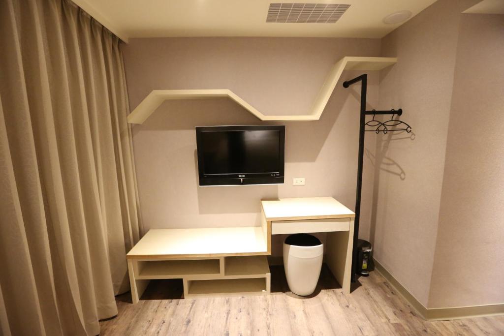 TV a/nebo společenská místnost v ubytování Central Hotel