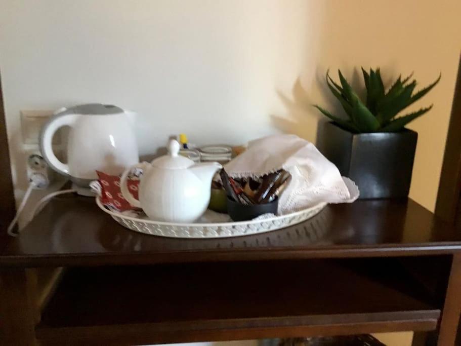 a table with a tea set and a tea pot at The Nest Filoxenia in Kato Trikala Korinthias