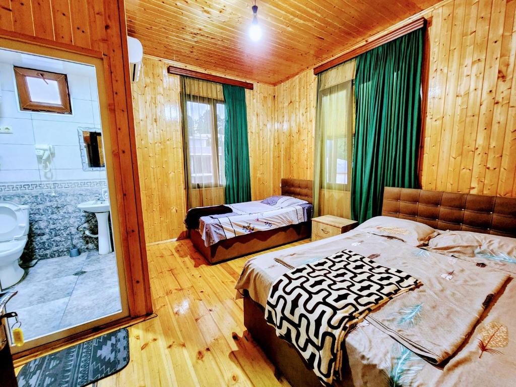 Postel nebo postele na pokoji v ubytování GUEST HOUSE NONA