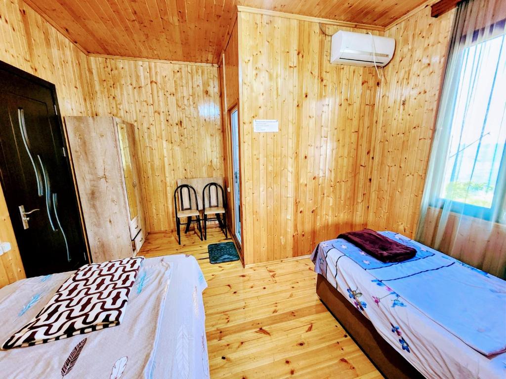 Postel nebo postele na pokoji v ubytování GUEST HOUSE NONA
