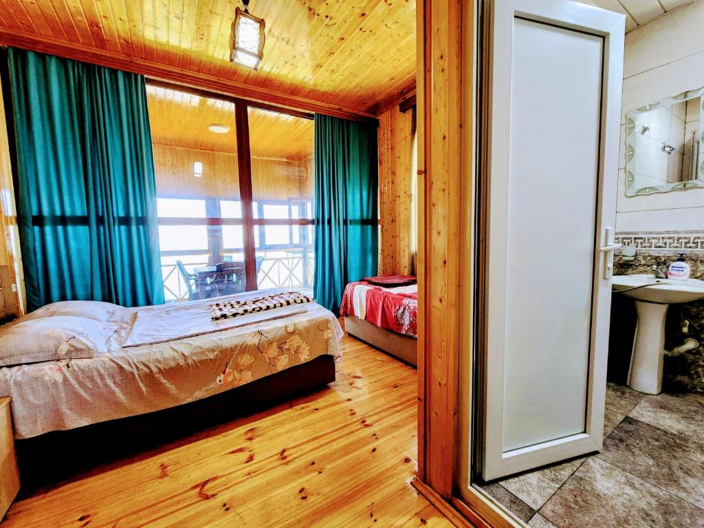Postel nebo postele na pokoji v ubytování GUEST HOUSE NONA