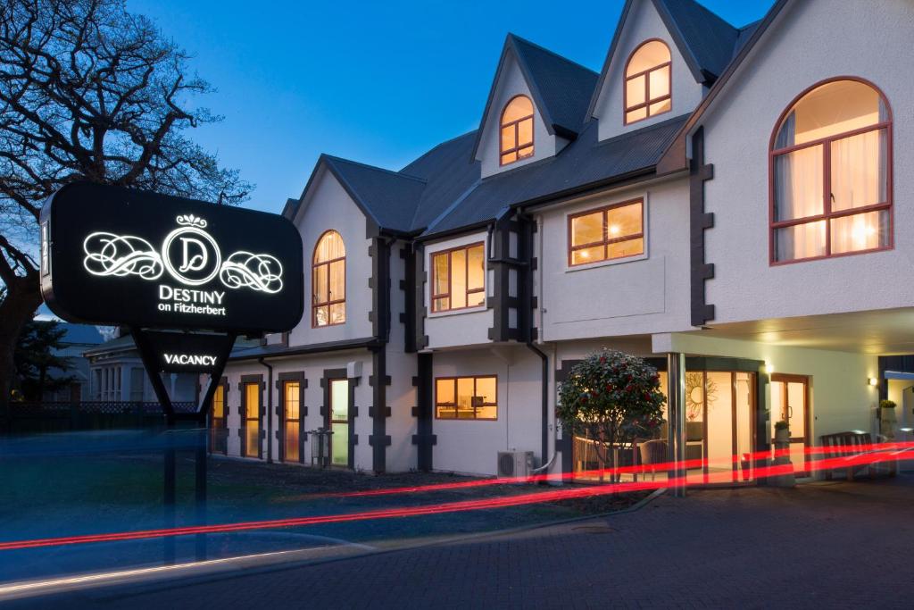 a building with a sign in front of it at ASURE Destiny on Fitzherbert Motel in Palmerston North
