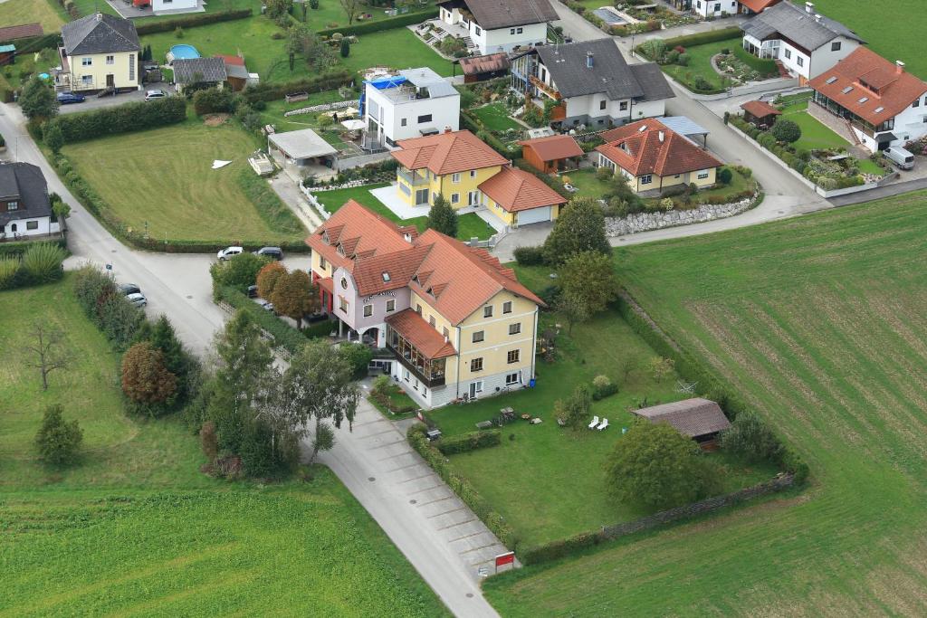 an aerial view of a large estate with houses at Hotel & Fitness Castello in Seewalchen