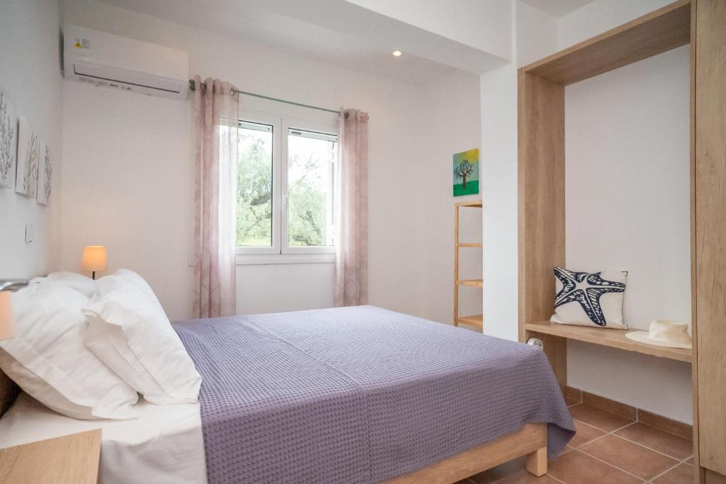 Postel nebo postele na pokoji v ubytování Villa Zoi