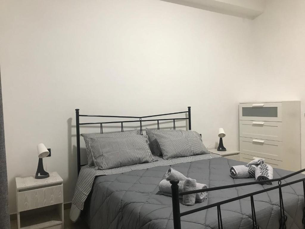 a bedroom with a bed with two stuffed animals on it at One bedroom apartement with balcony and wifi at Ribera in Ribera