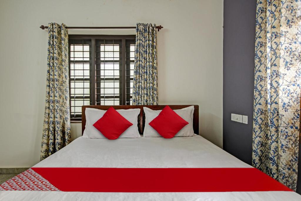 Llit o llits en una habitació de OYO Flagship Sanvilla