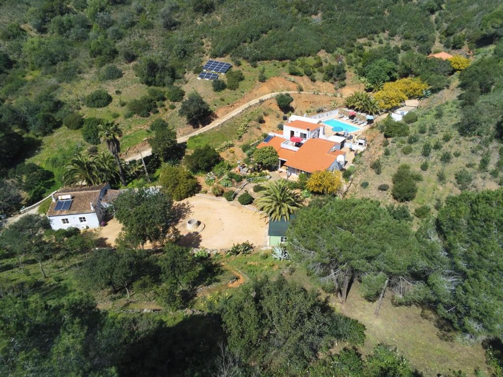 an aerial view of a house on a hill at Terra das Delicias in Morenos