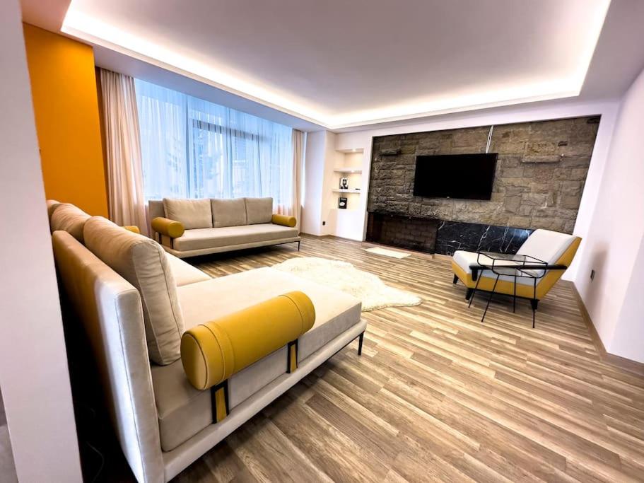 a living room with a couch and a fireplace at 102- Intimate Home in Ankara