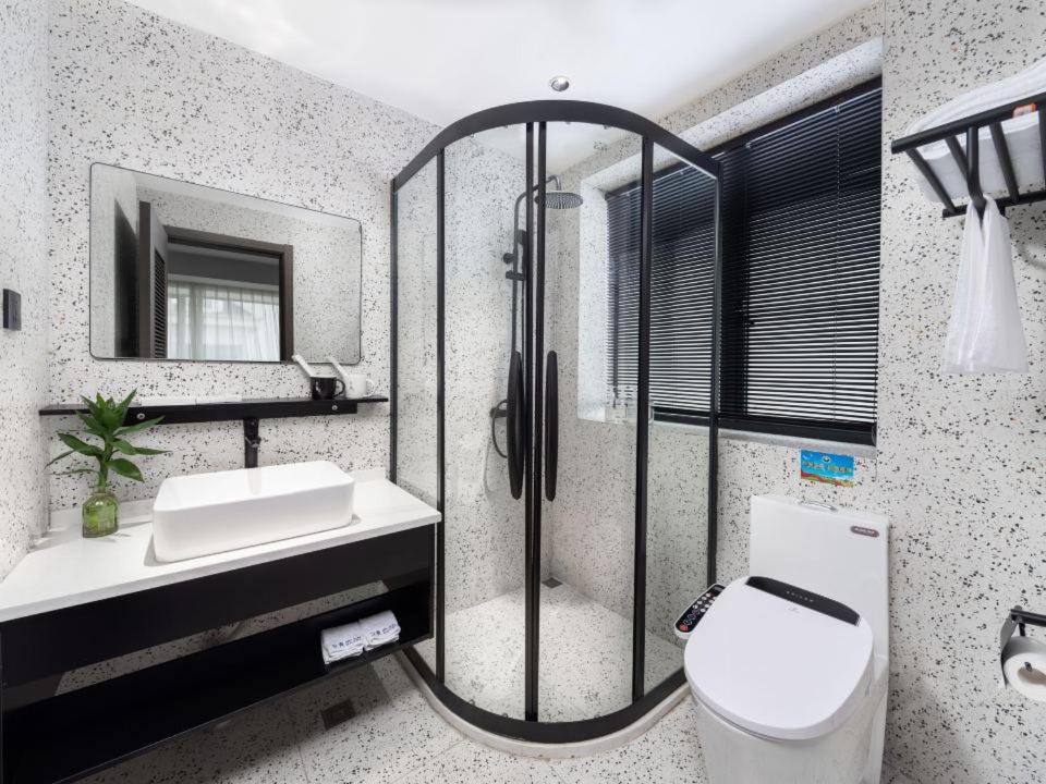 Koupelna v ubytování Yiwu Holly Hotel