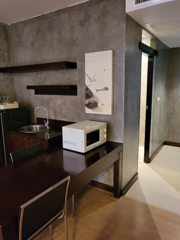 TV a/nebo společenská místnost v ubytování Silathip Huahin Serviced Apartment & Hotel