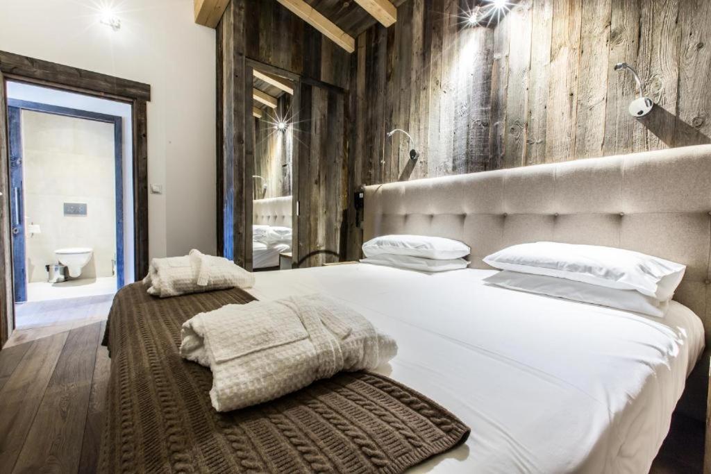 Postel nebo postele na pokoji v ubytování Hôtel Spa Crychar