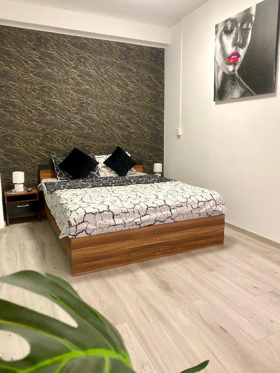 Postel nebo postele na pokoji v ubytování Militari Gorjului Residence