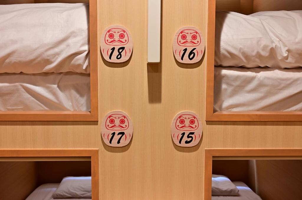 Postel nebo postele na pokoji v ubytování Hotel Tomariya Ueno