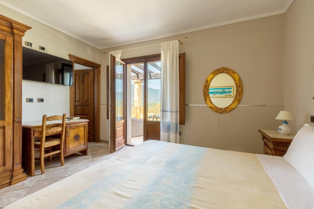 Postel nebo postele na pokoji v ubytování Hotel Sa Suergia