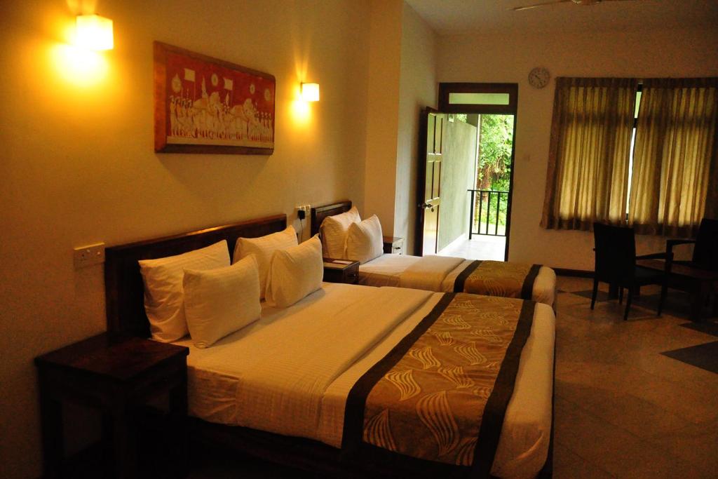 Postel nebo postele na pokoji v ubytování Spring Villas Kandy