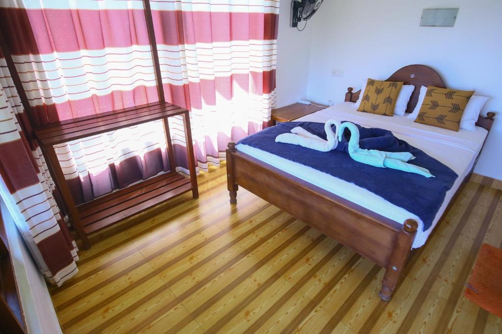 Postel nebo postele na pokoji v ubytování Ella Nine Arch lodge