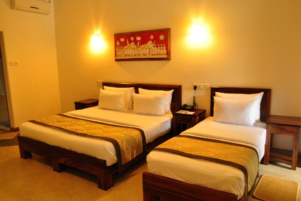 Postel nebo postele na pokoji v ubytování Spring Villas Kandy
