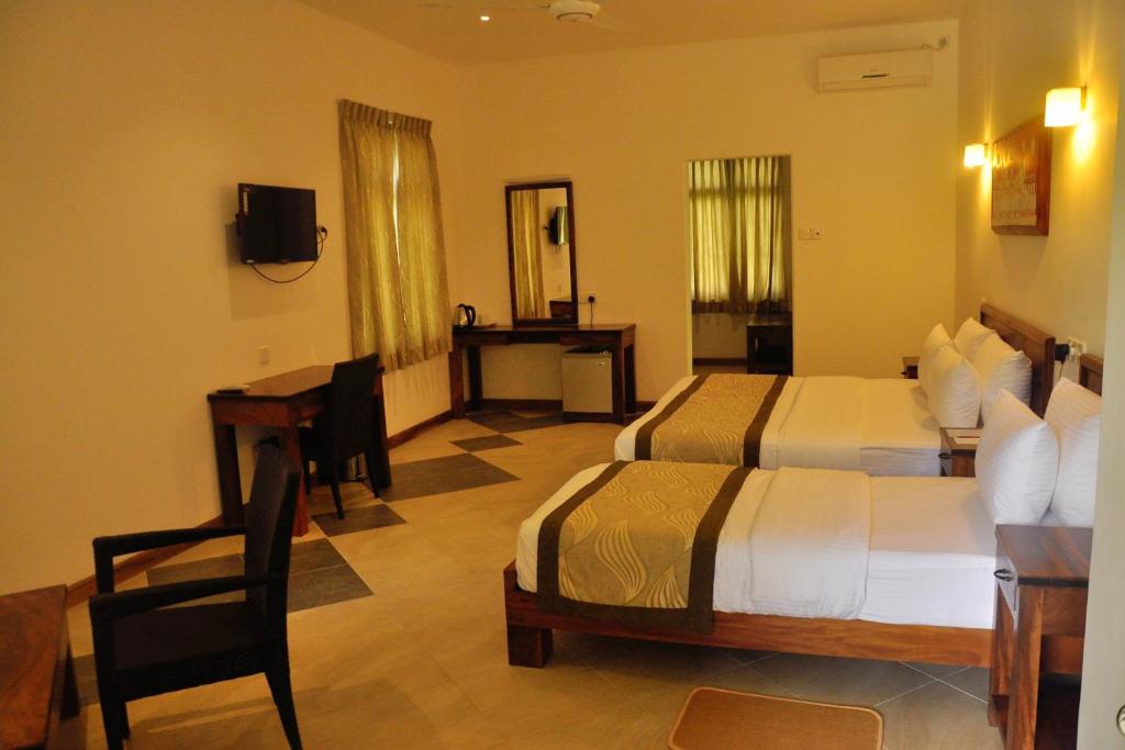 Postel nebo postele na pokoji v ubytování Spring Villas Kandy