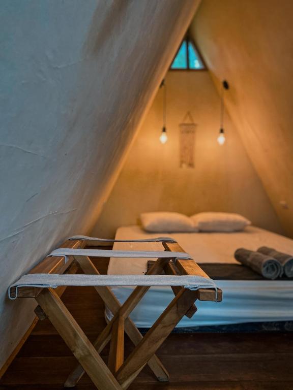 Postel nebo postele na pokoji v ubytování Basa-basi Lodge