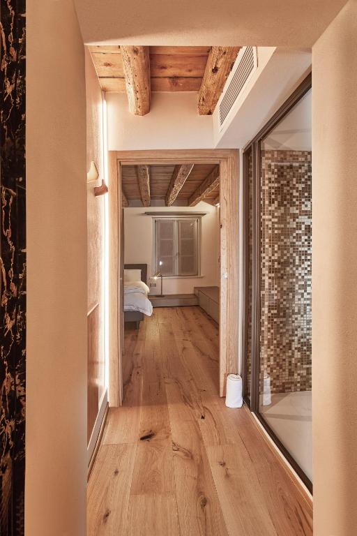 Postel nebo postele na pokoji v ubytování PALMANOVA SUITE HOME