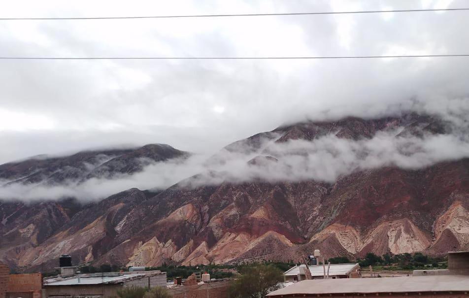 a view of a mountain with clouds over it at Maima Host II in Maimará