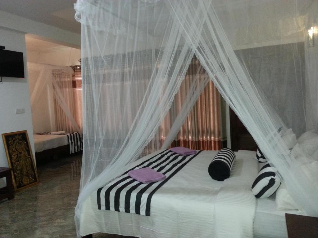 Postel nebo postele na pokoji v ubytování Wow Home Stay