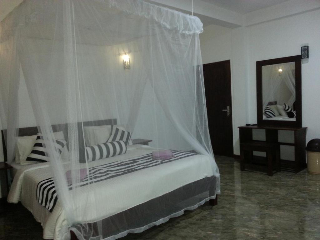 Postel nebo postele na pokoji v ubytování Wow Home Stay