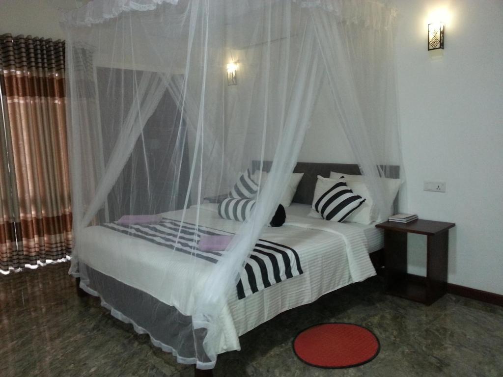 Postel nebo postele na pokoji v ubytování Wow Home Stay