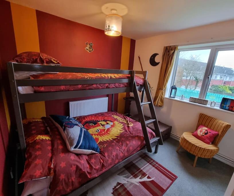 a bedroom with two bunk beds and a window at Apartment 9 3/4 in Watford