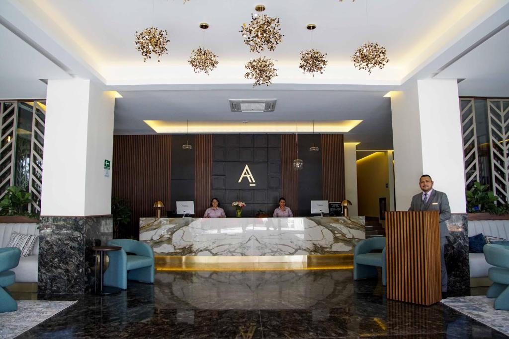 a lobby of a hotel with a reception desk at Hotel Antré Chapultepec in Guadalajara