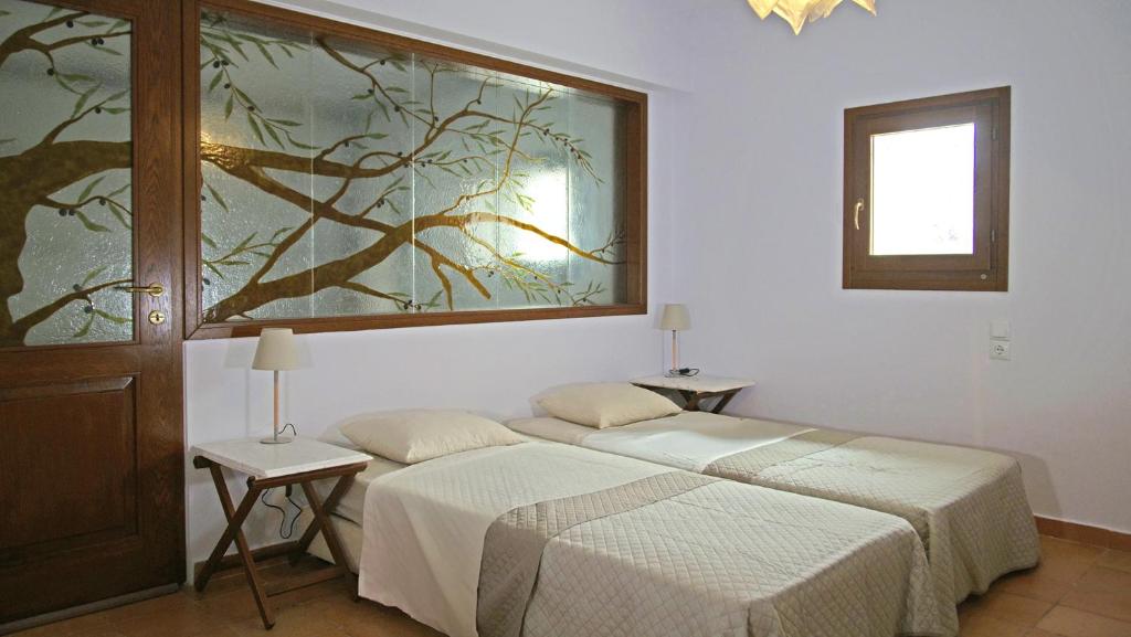 A bed or beds in a room at Apollo Beach House