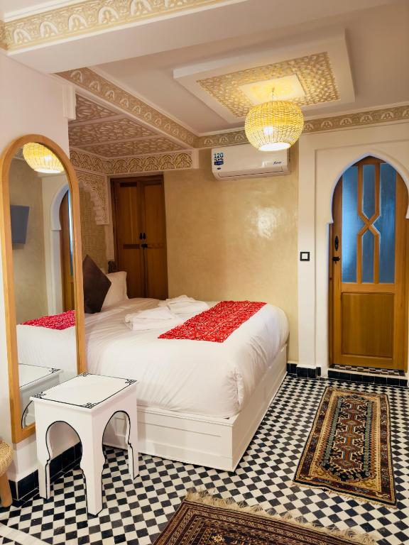 A bed or beds in a room at Dar MD