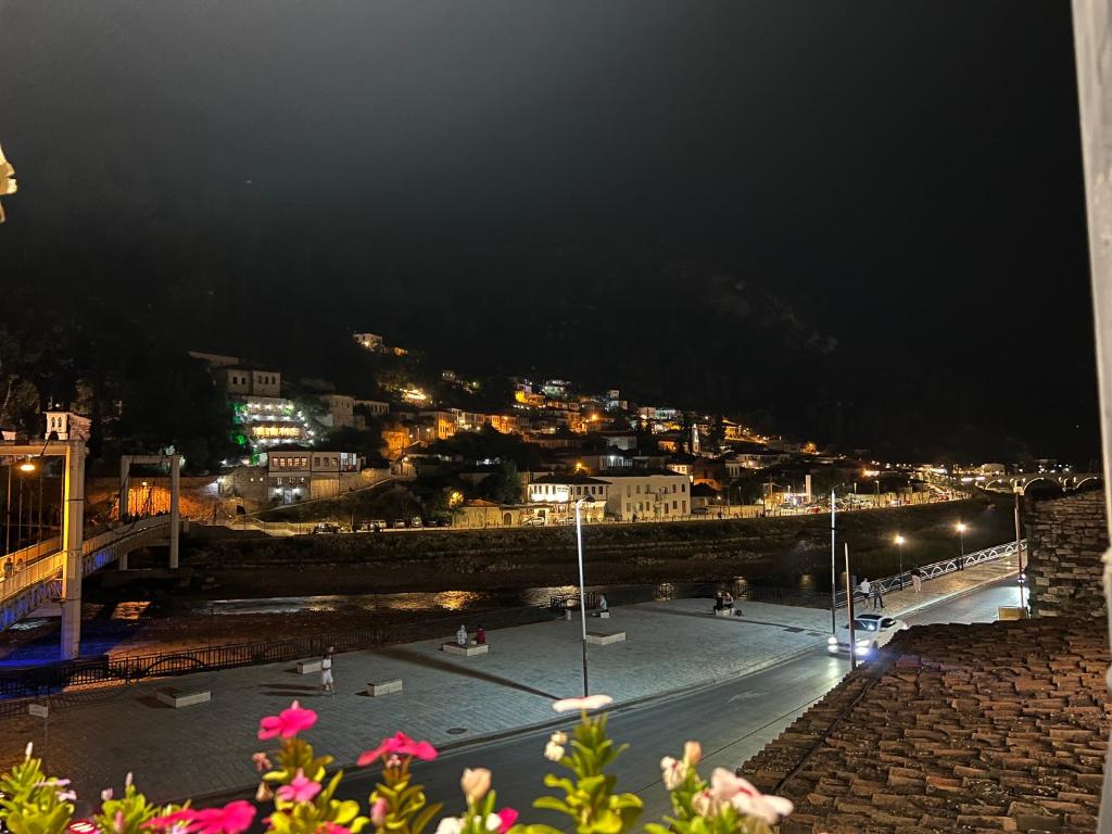 a view of a city at night with lights at Berat Private Appartment in Haxhialiu Villa in Berat