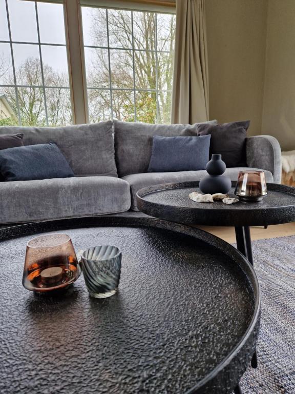 a living room with a couch and a table at Kustverhuur, Groede, Paarlhof 17 in Groede